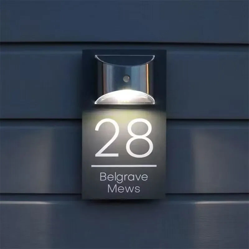 Solar powered house plaque