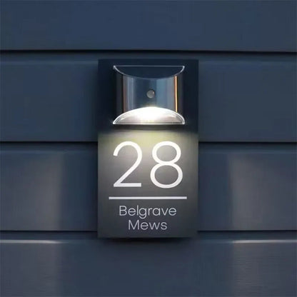 Solar powered house plaque